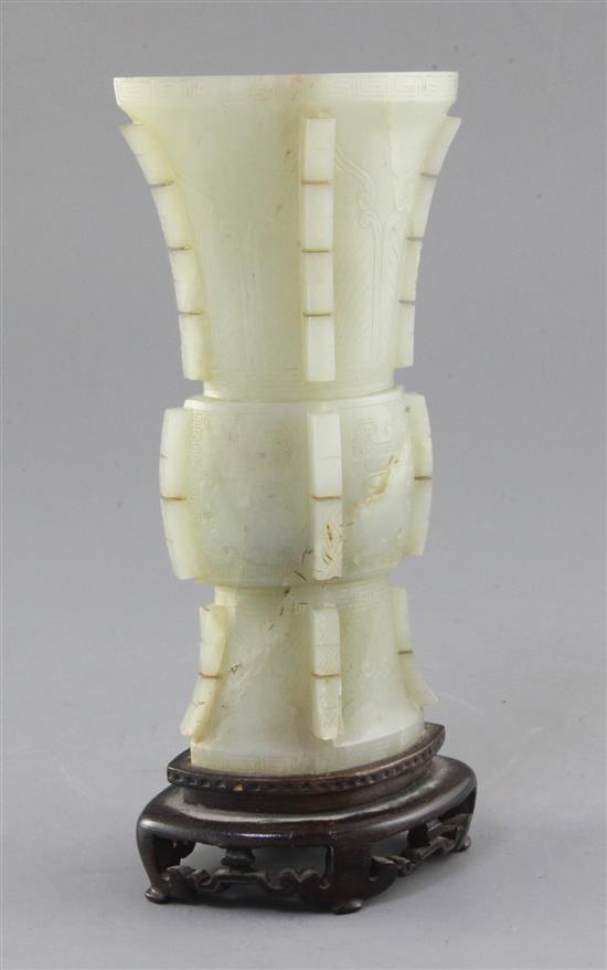 A Chinese archaistic pale celadon jade beaker vase